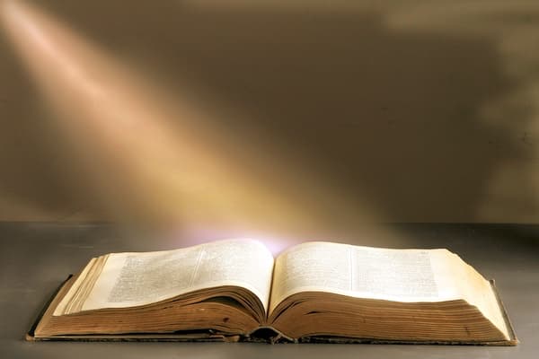 Open Bible Bathed in Golden Light