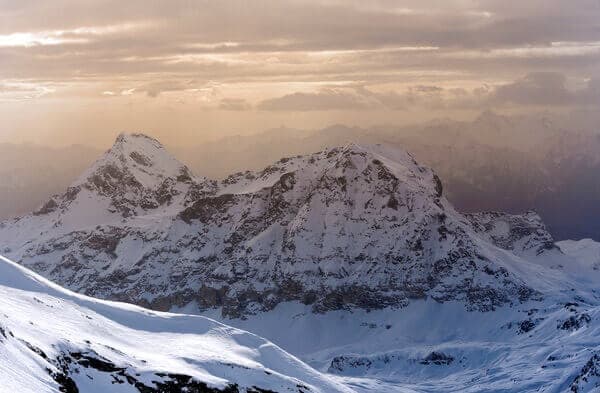 Snowy Mountains Beneath a Golden Sky