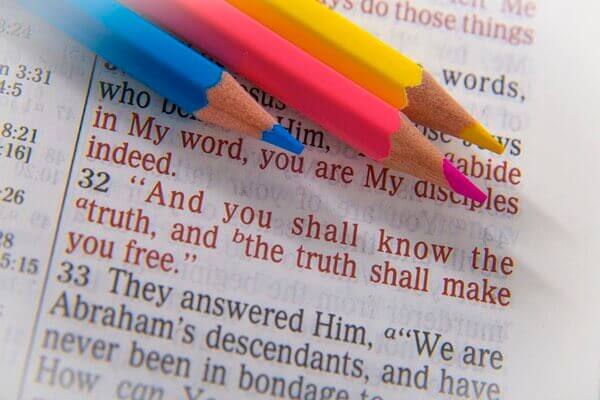 Colored Pencils Highlighting the Book of John, Chapter 8, Verse 32